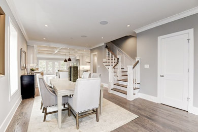 Great room - mid-sized transitional medium tone wood floor and brown floor great room idea in DC Metro with gray walls and no fireplace