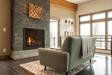 Living room - mid-sized transitional formal and loft-style dark wood floor and brown floor living room idea in Other with beige walls, a standard fireplace, a stone fireplace and no tv