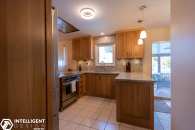 Kitchen - kitchen idea in Other with an undermount sink, shaker cabinets, light wood cabinets and stainless steel appliances