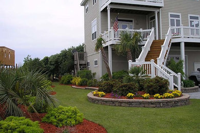 Photo of a mid-sized full sun backyard landscaping in Other.