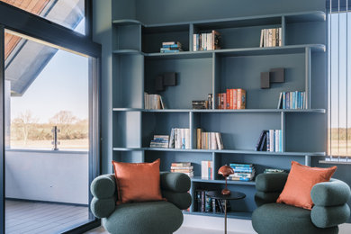 Photo of an expansive contemporary master bedroom in Cambridgeshire with blue walls, ceramic flooring, beige floors and a vaulted ceiling.