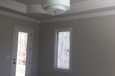 Living room - mid-sized living room idea in Raleigh with white walls