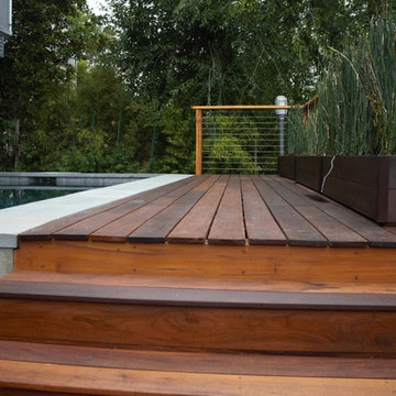 Contemporary backyard pool deck