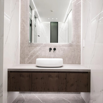 Floating Timber Vanity with Large-Format Stone Walls