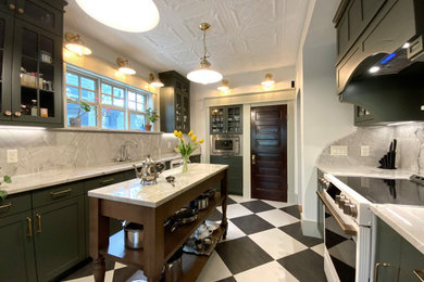 Example of a small ornate galley laminate floor eat-in kitchen design in Calgary with a double-bowl sink, shaker cabinets, green cabinets, quartzite countertops, green backsplash, white appliances, an island and green countertops
