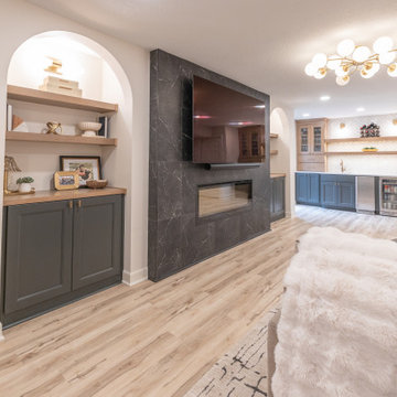 Warm & Inviting Basement Retreat with Custom Bar + Entertainment Center