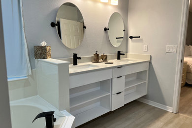 Bathroom - small contemporary master vinyl floor and double-sink bathroom idea in Orlando with open cabinets, white cabinets, gray walls, an undermount sink, quartz countertops, white countertops and a floating vanity