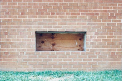 Beige brick exterior home idea in Baltimore