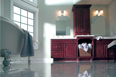 Large elegant master white tile marble floor claw-foot bathtub photo in Orange County with raised-panel cabinets, medium tone wood cabinets, white walls and quartzite countertops