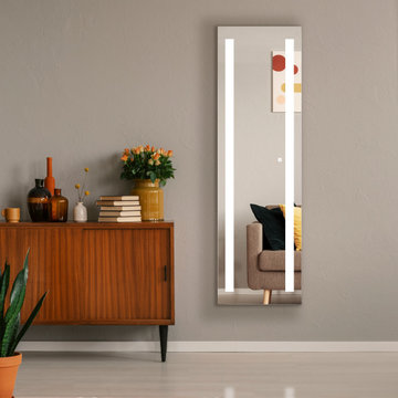 Entryway with full length lighted mirror and midcentury bookshelf