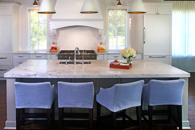 Inspiration for a large coastal dark wood floor open concept kitchen remodel in Jacksonville with a single-bowl sink, shaker cabinets, white cabinets, marble countertops, white backsplash, subway tile backsplash and an island