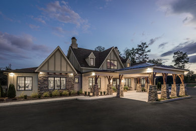 Large transitional multicolored one-story mixed siding exterior home photo in Other with a metal roof