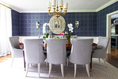 Example of a transitional dark wood floor and brown floor dining room design in New York with blue walls