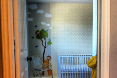 Small minimalist boy laminate floor kids' bedroom photo in Toronto with blue walls