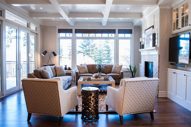 Mid-sized elegant open concept dark wood floor living room photo in Calgary with gray walls, a standard fireplace, a stone fireplace and a media wall