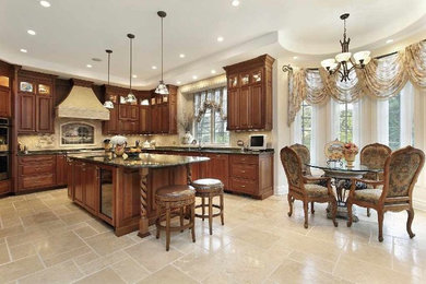Mid-sized minimalist u-shaped travertine floor and beige floor eat-in kitchen photo in Atlanta with an undermount sink, beaded inset cabinets, medium tone wood cabinets, granite countertops, beige backsplash, stone tile backsplash, stainless steel appliances and an island