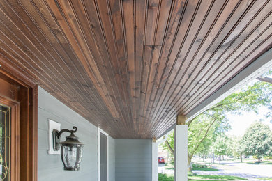 Inspiration for a mid-sized timeless gray two-story concrete fiberboard exterior home remodel in Chicago with a shingle roof