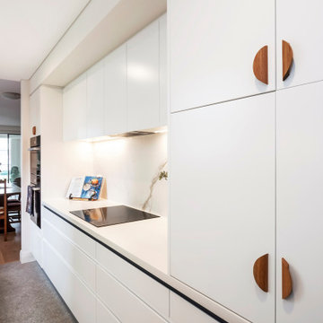 Galley Kitchen with Corian Benchtops and Porcelain Splashback