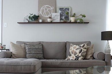 Living room - mid-sized 1950s enclosed medium tone wood floor and brown floor living room idea in Other with gray walls