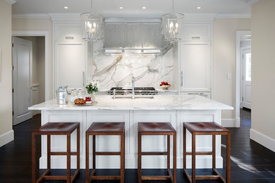Example of a classic dark wood floor and brown floor kitchen design in Chicago with an undermount sink, marble countertops, white backsplash, marble backsplash, stainless steel appliances, an island and white countertops