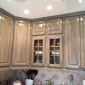 Mineola, NY: White Kitchen cabinets hand painted with a faux grey wood finish
