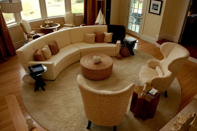 Example of a mid-sized trendy formal light wood floor and brown floor living room design with beige walls, a standard fireplace and a stone fireplace