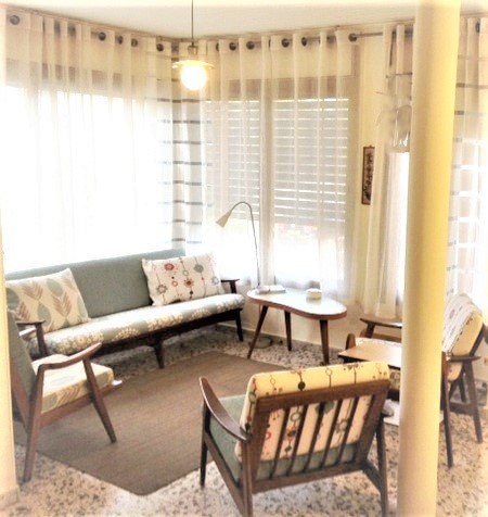Cozy reading area. Kept all pieces from the 70s, even added 1 more arm chair