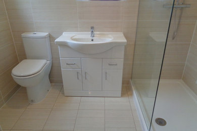 Photo of a mid-sized modern bathroom in West Midlands.