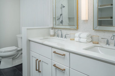 Mid-sized minimalist master white tile and mosaic tile porcelain tile, gray floor, double-sink and wall paneling doorless shower photo in Philadelphia with shaker cabinets, white cabinets, a bidet, white walls, a drop-in sink, quartz countertops, a hinged shower door, white countertops, a niche and a built-in vanity