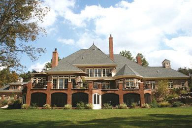 Inspiration for a timeless stone exterior home remodel in Columbus