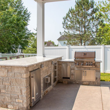 Open Gable Pool House with Fireplace and Grilling Area