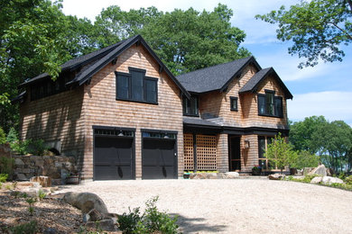 Example of an arts and crafts exterior home design in Portland Maine