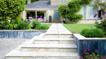 Contemporary town garden with weathered zinc walls in Bath