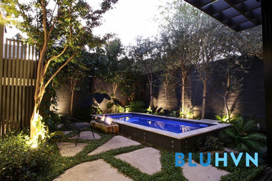 Backyard rectangular pool in Sydney with tile.