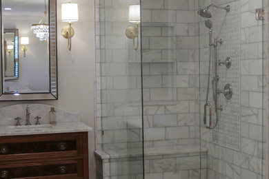 Inspiration for a large transitional master bathroom in Atlanta with furniture-like cabinets, brown cabinets, a freestanding tub, a corner shower, white walls, marble floors, an undermount sink, marble benchtops, white floor, a hinged shower door and white benchtops.