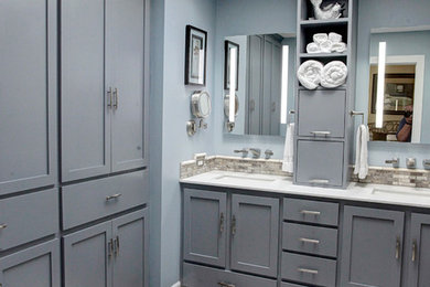 Corner shower - mid-sized modern master beige tile and terra-cotta tile laminate floor corner shower idea in Houston with gray cabinets, gray walls, an undermount sink and quartzite countertops