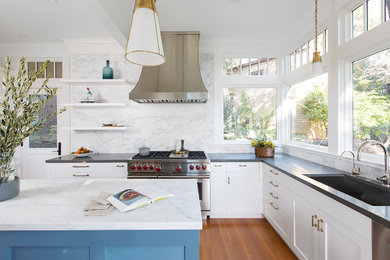 Inspiration for a mid-sized transitional u-shaped brown floor and light wood floor eat-in kitchen remodel in San Francisco with shaker cabinets, white cabinets, marble countertops, white backsplash, marble backsplash, an island, gray countertops, stainless steel appliances and a drop-in sink