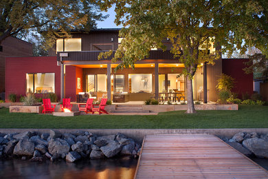 Patio - large transitional backyard concrete patio idea in Other with a fire pit and a roof extension