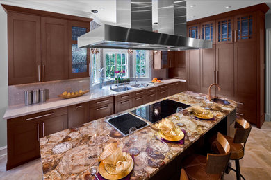 Kitchen - large transitional u-shaped travertine floor kitchen idea in Los Angeles with shaker cabinets, medium tone wood cabinets, quartz countertops and an island