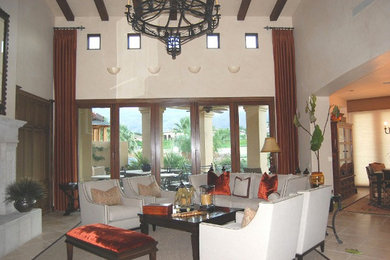Inspiration for a large open concept ceramic tile living room remodel in Los Angeles with beige walls and a standard fireplace