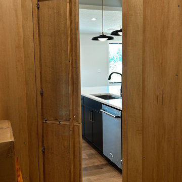 Maple Pecan Stain and Painted Black Kitchen Design in Bettendorf, Iowa