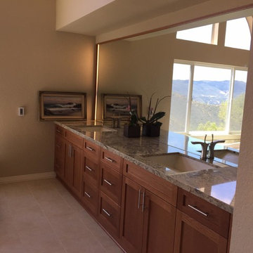 His and hers sinks, shaker oak cabinets