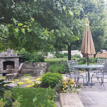 A vegetable garden in the background of a backyard oasis