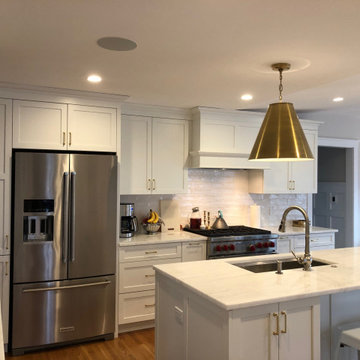 Belmont, MA White Dura Supreme kitchen with statement gold pendants