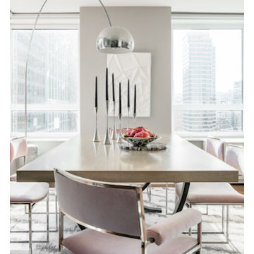 Decorative table objects give the crisp apartment a more personalized feel