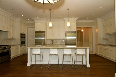 Example of a transitional kitchen design in Toronto