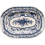 Danny's Fine Porcelain - Porcelain blue and white oval platter - Classic blue and white oval platter. Hand painted elegant floral design. The back of the plate is pre-drilled 2 hanging holes that can add wire or ribbons for wall hanging without needing an extra plate hanger. It is great for place on the book shelf or cases. Measures 10L X 7.5W X 1H. Plate stand not included.
