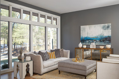 Inspiration for a mid-sized contemporary open concept light wood floor living room remodel in Grand Rapids with gray walls