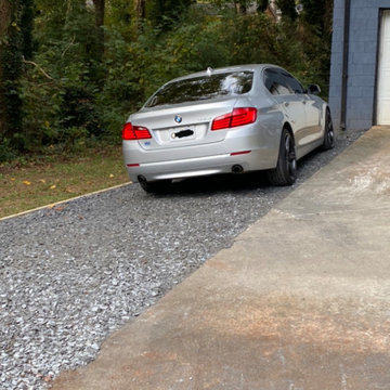 Slate rock driveway and slate rock walkway to the basement.