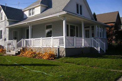 Example of a large classic gray two-story vinyl exterior home design in Toronto